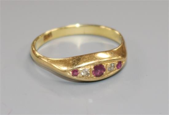 An 18ct gold, small five stone ruby and diamond ring, size Q/R.